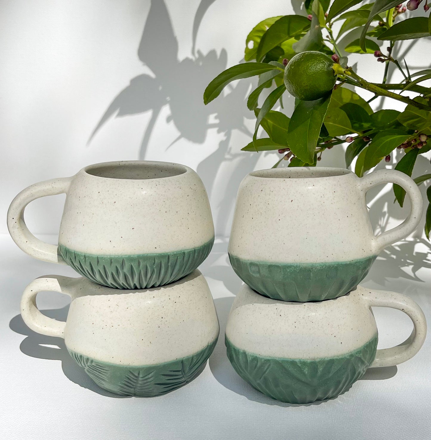 Crema White and Dark Green Patina Mugs